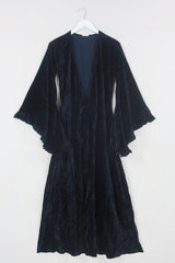 Flat lay of our Venus Maxi Dress in Morticia Black Velvet tied at the front as a kimono by All About Audrey