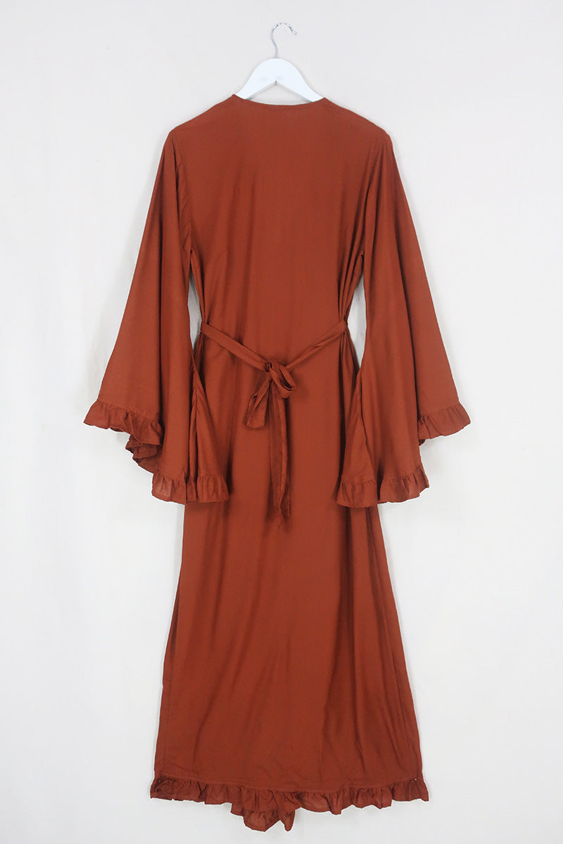 Back flat lay of our Khroma Venus Robe Dress in Red Clay shown tied at the front in a robe style by All About Audrey