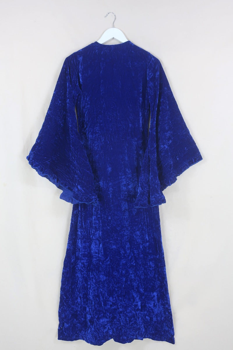 Back flat lay of our Khroma Venus Maxi Dress in Regal Blue Velvet tied at the front like a kimono by All About Audrey