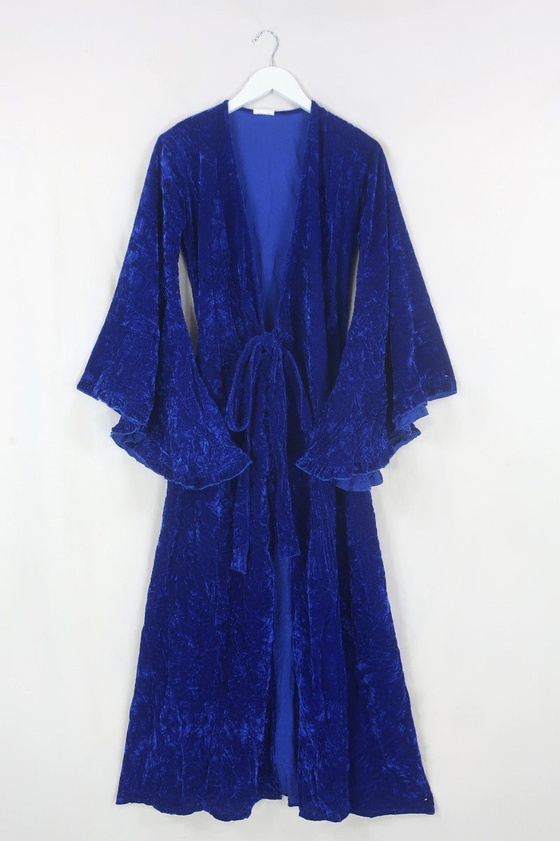 Front flat lay of our Khroma Venus Maxi Dress in Regal Blue Velvet tied at the front like a kimono by All About Audrey