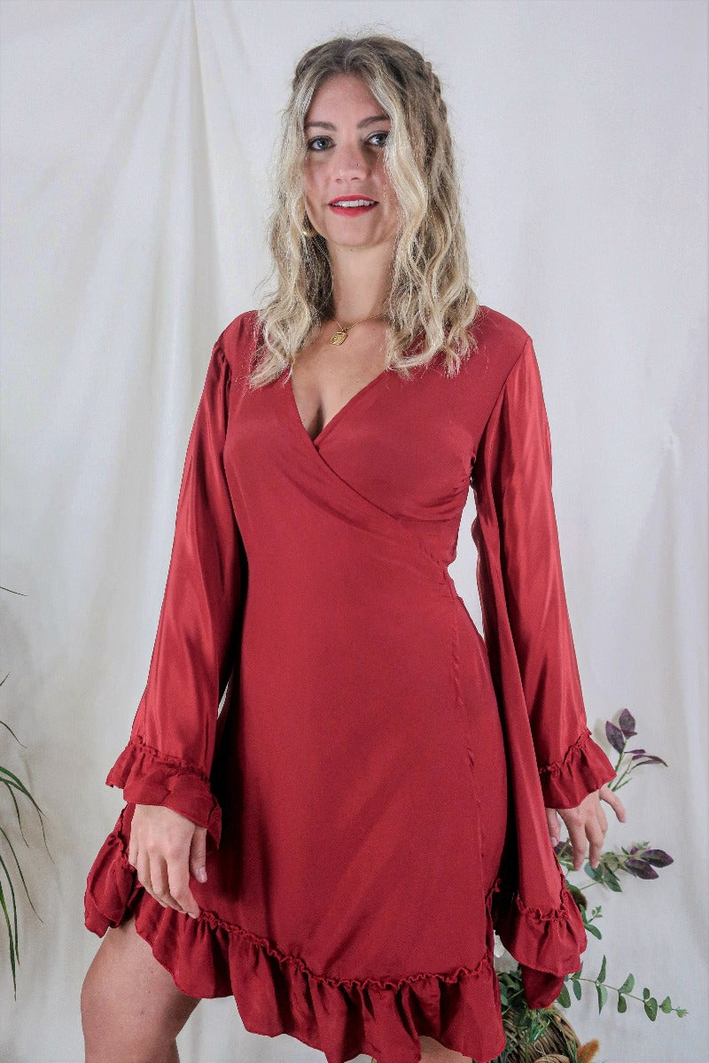 Model wears our Venus Khroma wrap dress in Scarlet Red, a spicy and bold red tone which is easy to style and versatile to wear! Our model wears it here wrapped at the waist. Inspired by 70's bohemia by All About Audrey