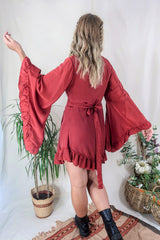 Model wears our Venus Khroma wrap dress in Scarlet Red, a spicy and bold red tone which is easy to style and versatile to wear! Our model wears it here wrapped at the waist. Inspired by 70's bohemia by All About Audrey