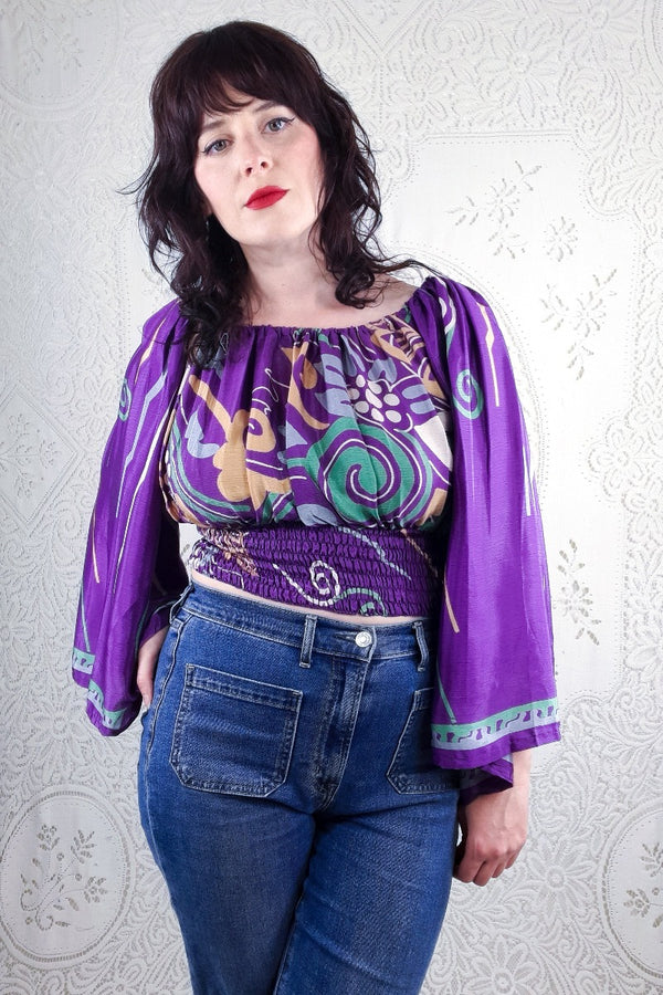This gorgeous bold and graphic floral swirl, Scorpio top has tones of purple, bottle green, baby blue and stone. 