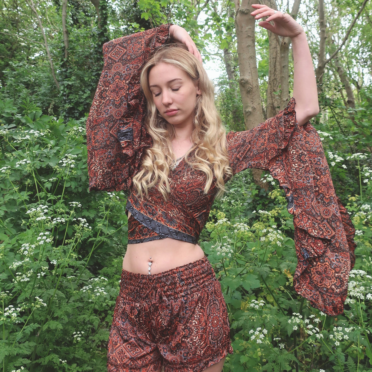 UK size 6/8 model wearing matching Venus frilly 70s wrap top and frilly boho shorts in earthy tone rust red & jet black Moroccan mandala tile print by all about audrey
