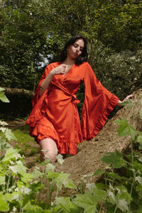 model wearing Khroma Venus Mini Wrap Dress in Chili Red by all about audrey