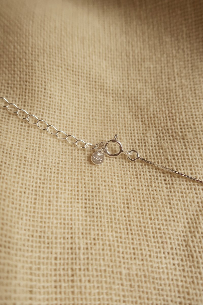 Silver Cut Out Crescent Moon Charm Necklace by All About Audrey