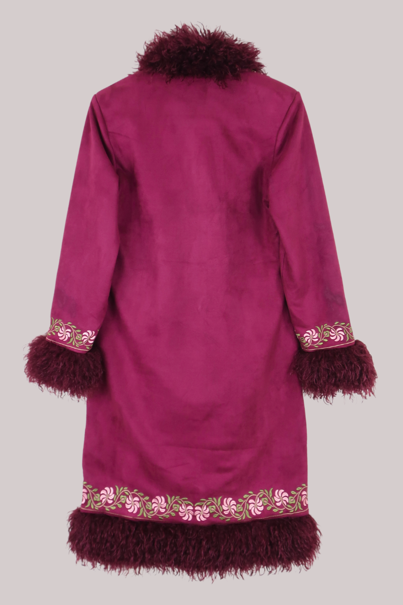 Burgundy red coat with decorative trim on a plain background