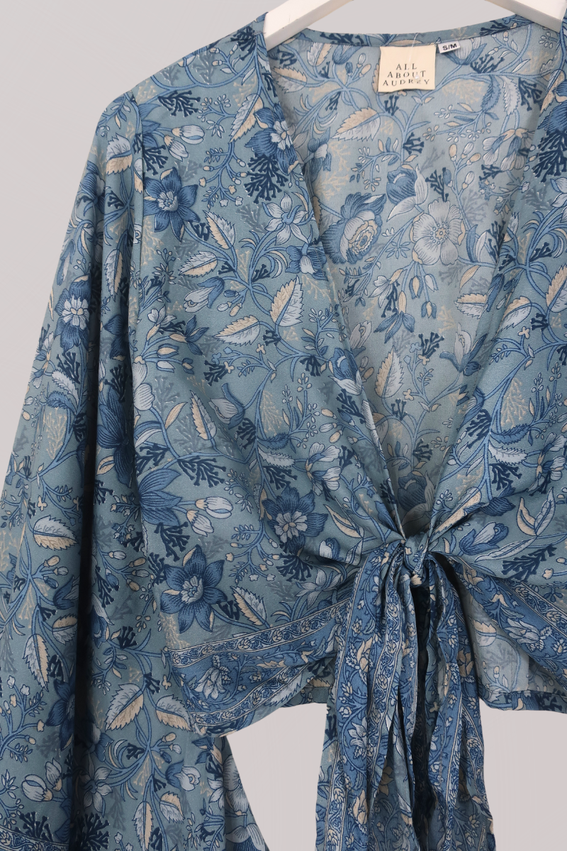 Venus Folklore Floral Wrap Top in Forget Me Not Blue by All About Audrey