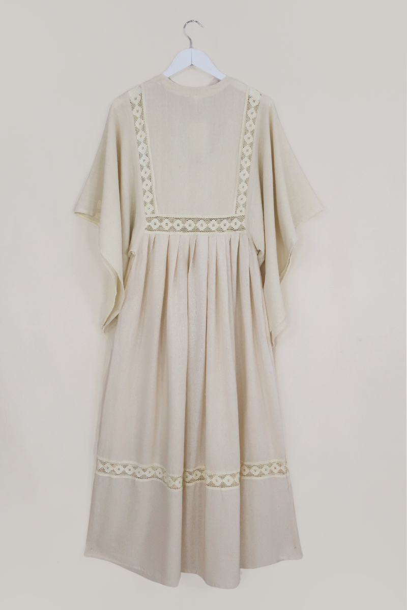 Flatlay of our Cordelia Midi Dress in Ivory White by All About Audrey