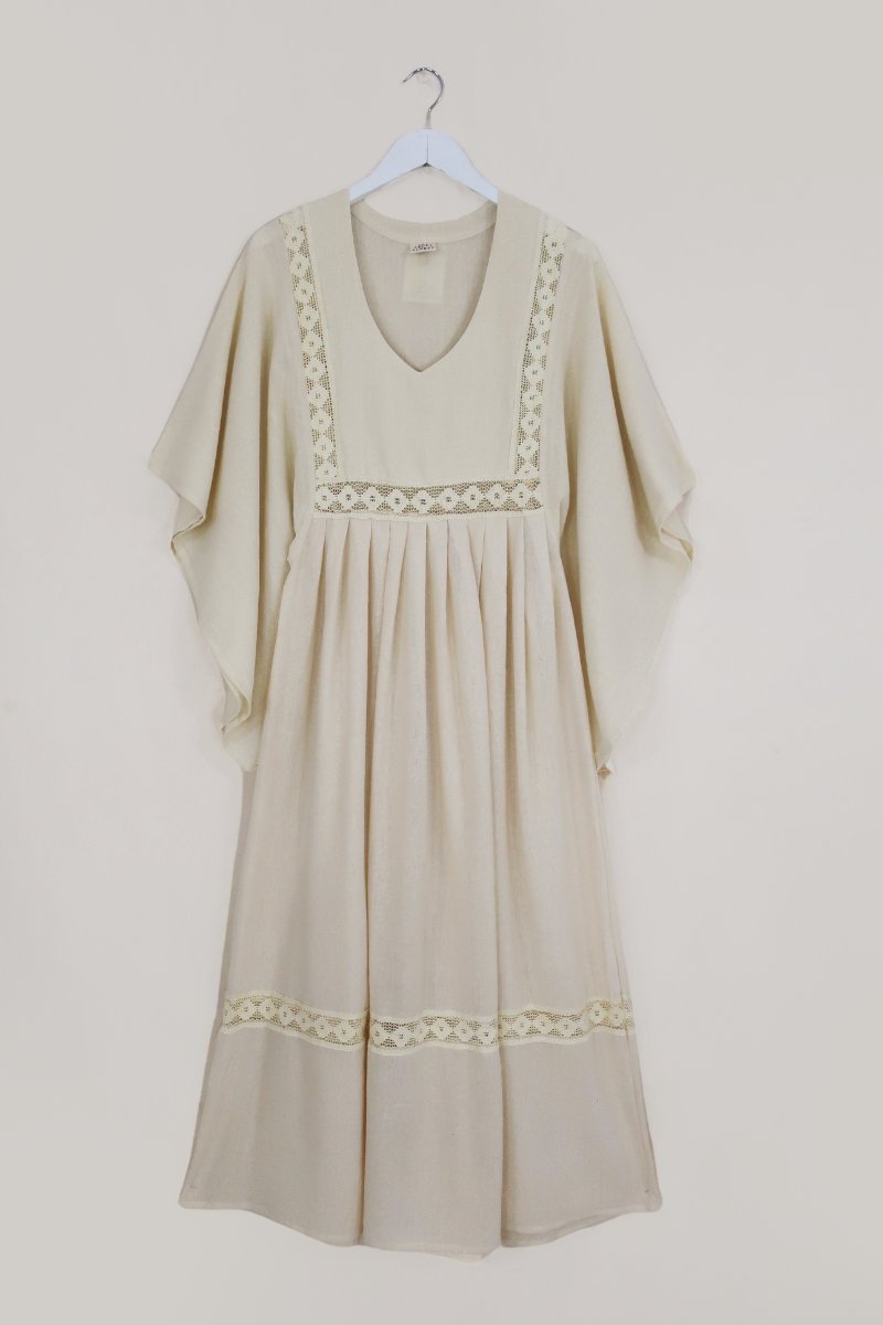 Flatlay of our Cordelia Midi Dress in Ivory White by All About Audrey