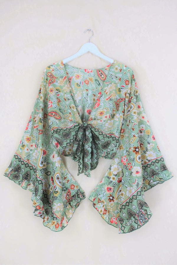 This Porcelain Green print features regal metallic gold detailing, paisley and flora patterns in a soft sage tone. And of course our signature frill bell sleeves, combining a little bit of drama with an & easy to wear print!