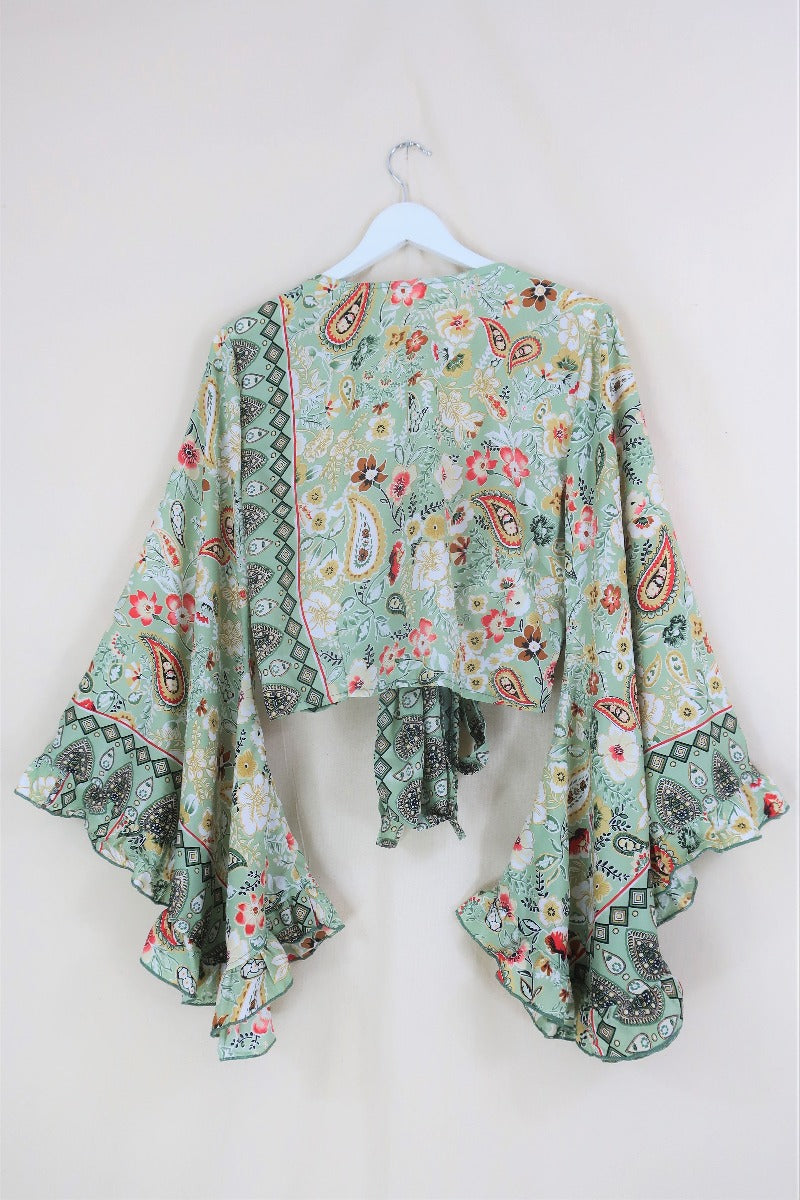  This Porcelain Green print features regal metallic gold detailing, paisley and flora patterns in a soft sage tone. And of course our signature frill bell sleeves, combining a little bit of drama with an & easy to wear print!