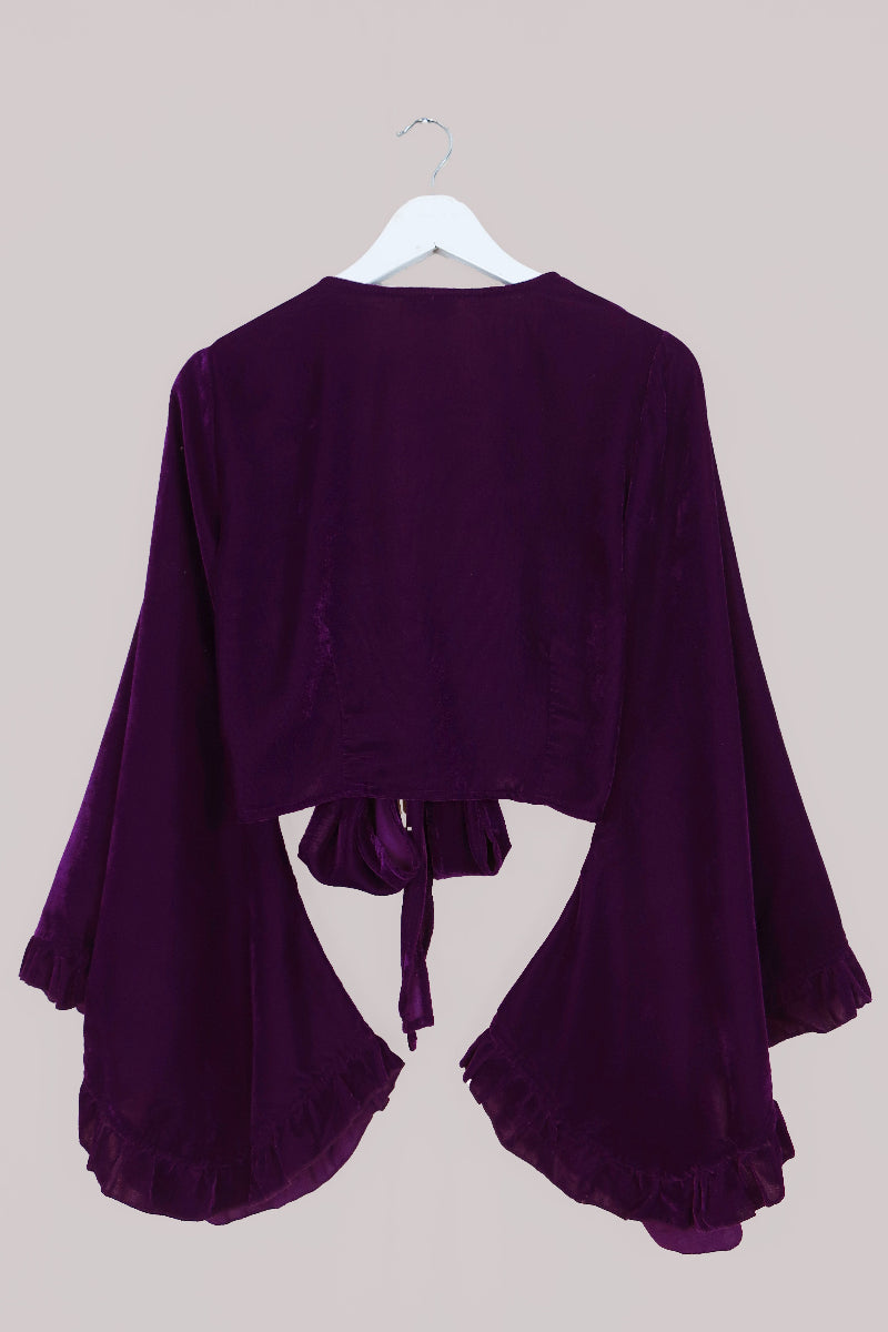 Vintage 1970's inspired velvet Venus top in Purple Quartz. A deep but vibrant jewel tone in a luxurious soft velvet. A tie wrap front with retro and iconic butterfly sleeves by All About Audrey