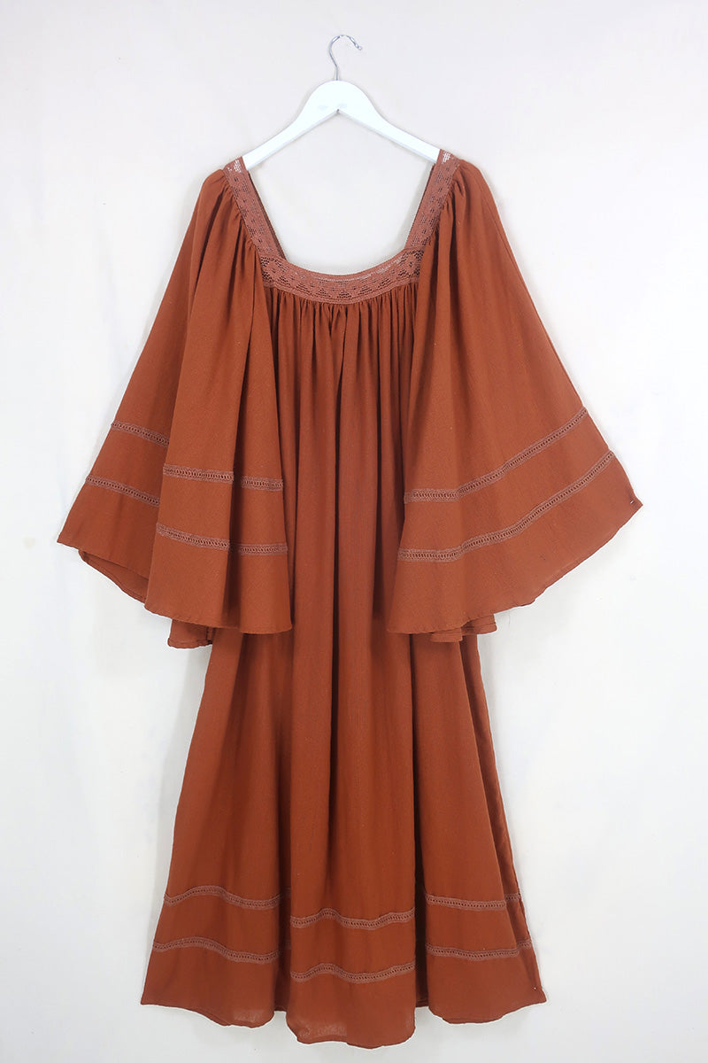 Flat lay of our Raven Maxi Dress in Red Clay by All About Audrey