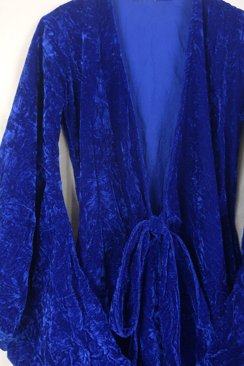 Front flat lay of our Khroma Venus Maxi Dress in Regal Blue Velvet tied at the front like a kimono by All About Audrey