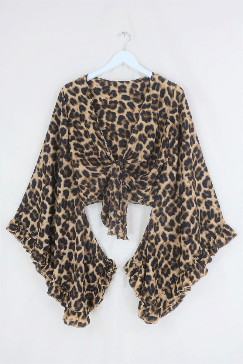 A wild twist on our staple Venus wrap top! This Savanna Leopard print will always be timeless! A bold, all over animal pattern in sandy gold, brown and black tones. And of course our signature frill bell sleeves - it's combining a little bit of drama with an easy to wear print! By All About Audrey