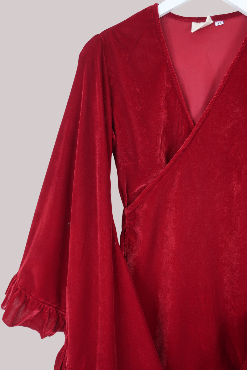 Red dress with long sleeves on a white background