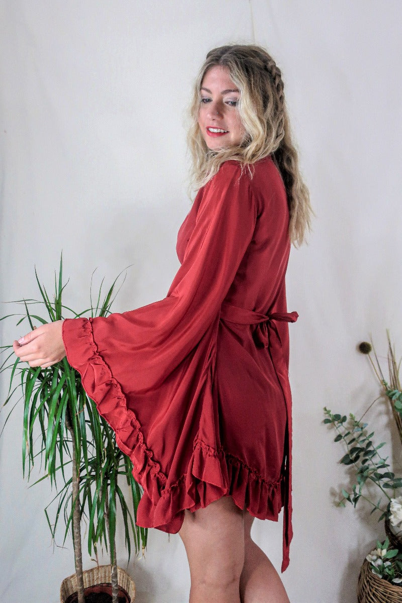 Model wears our Venus Khroma wrap dress in Scarlet Red, a spicy and bold red tone which is easy to style and versatile to wear! Our model wears it here wrapped at the waist. Inspired by 70's bohemia by All About Audrey