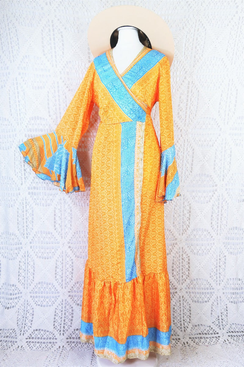 apricot orange and powdered blue maxi wrap dress with drop hem and frill sleeve pinned out