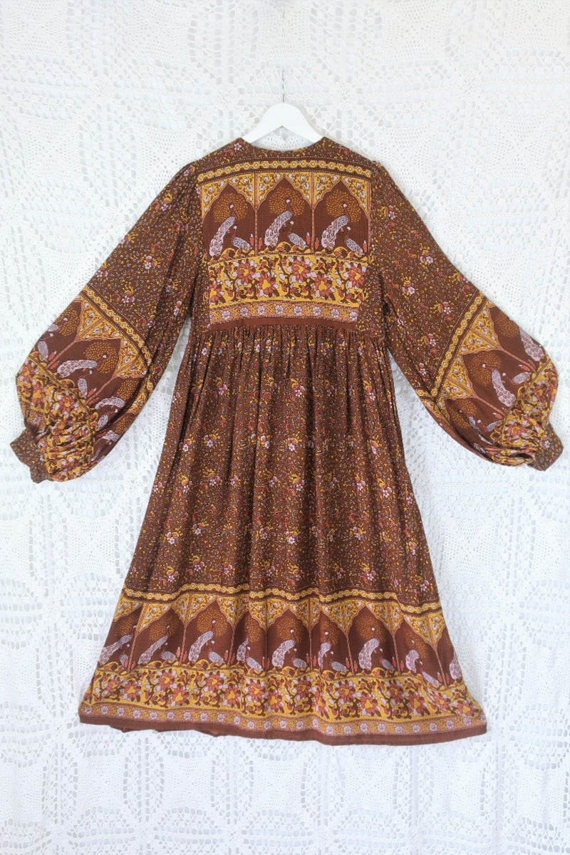 back peacock primrose midi dress with balloon sleeves in 70s smocked style indian printed rayon colour gingerbread by all about audrey
