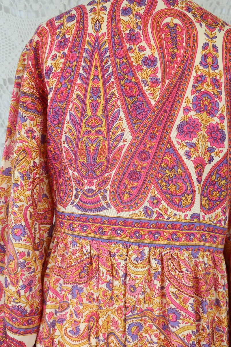 close up back bodice florence mini short bohemian style dress with balloon sleeve and button down contrast yolk in flower and paisley print colour ivory violet and rose by all about audrey