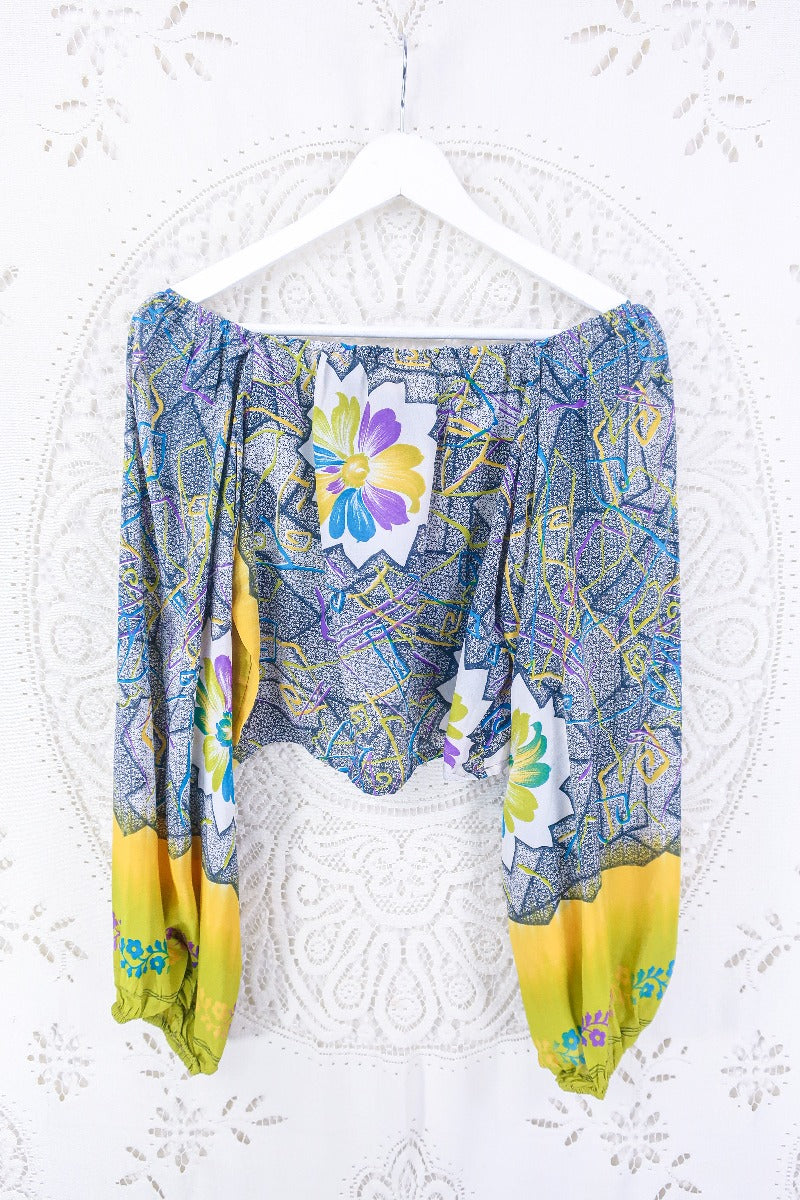 Back view of our gorgeous Ariel top with sweet heart neck line and ruched chest. tones of slate grey and sunshine yellow.