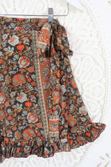 Close up of our Venus Mini wrap skirt. This skirt has a tie waist and is free size.  Gorgeous baroque floral print in blue , orange and brown tones. 