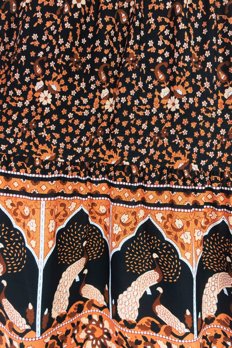 close up showing print on peacock prairie maxi skirt in indian block printed style sustainable rayon fabric colour jet black and terracotta by all about audrey