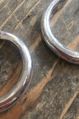 close up medium silver painted thin hoops from our collection of vintage inspired bohemian jewellery and accessories by all about audrey