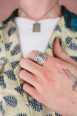 close up model wears silver plated eye of providence ring with antique effect finish by all about audrey
