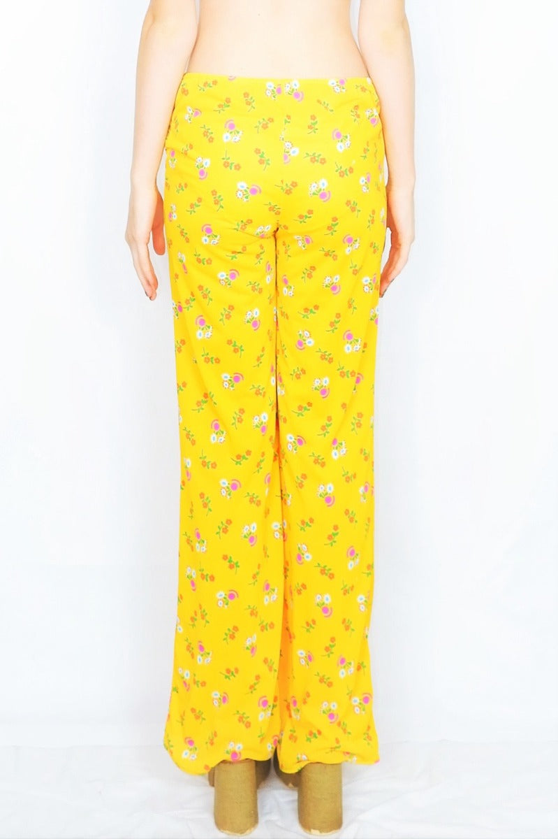 co-ordinating 70 vintage hippy straight leg trousers in solar yellow with a floral print - All About Audrey
