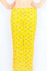co-ordinating 70 vintage hippy straight leg trousers in solar yellow with a floral print - All About Audrey