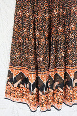 close up contrast hemline peacock prairie maxi skirt in indian block printed style sustainable rayon fabric colour jet black and terracotta by all about audrey