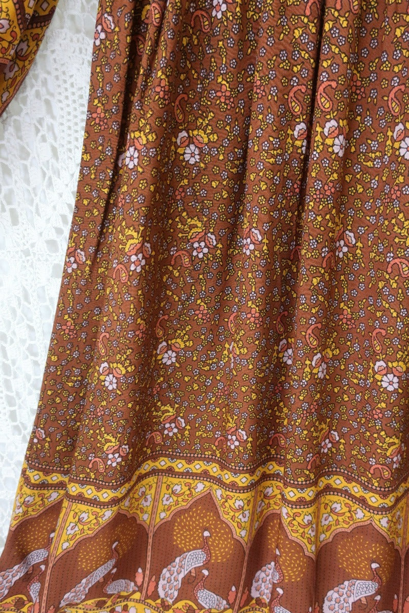 detail hem and print peacock primrose midi dress with balloon sleeves in 70s smocked style indian printed rayon colour gingerbread by all about audrey