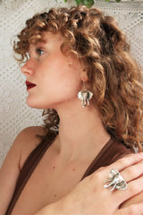 side view model wears silver plated chunky elephant ring and matching earrings from our bohemian turkish jewellery collection by all about audrey