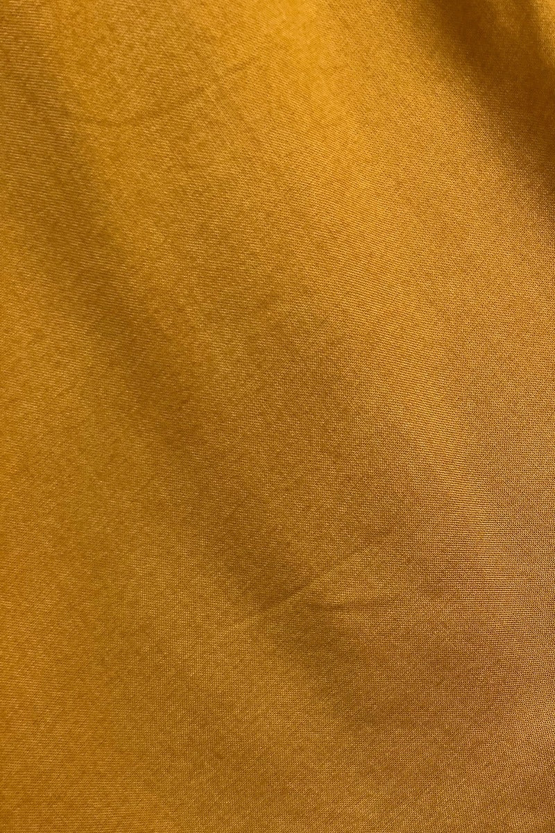 Colour swatch of our Khroma Venus top in Mustard Yellow by All About Audrey