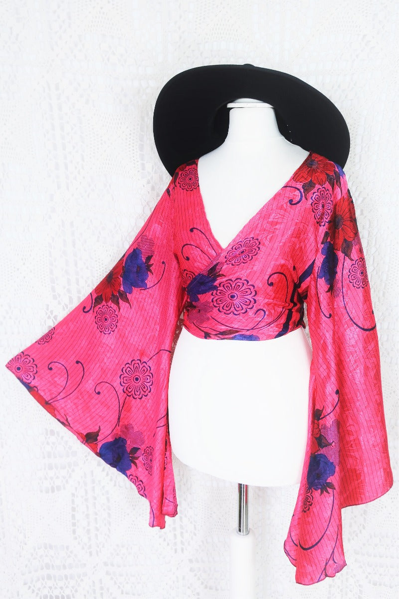 dark pink navy blue and red floral print gemini bell sleeve boho wrap top with shimmering jacquard stiching photographed on a uk size 8 mannequin by all about audrey