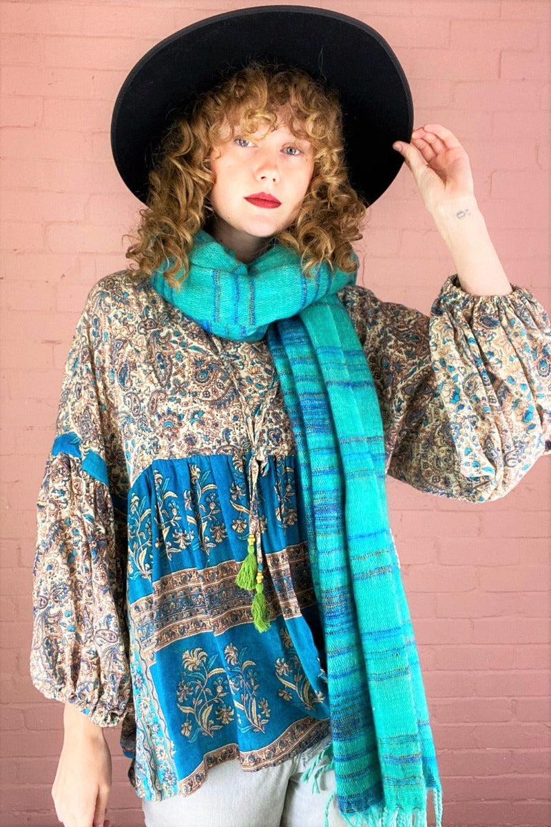model posing with seafoam & blue stripey scarf wrapped once around neck - All About Audrey