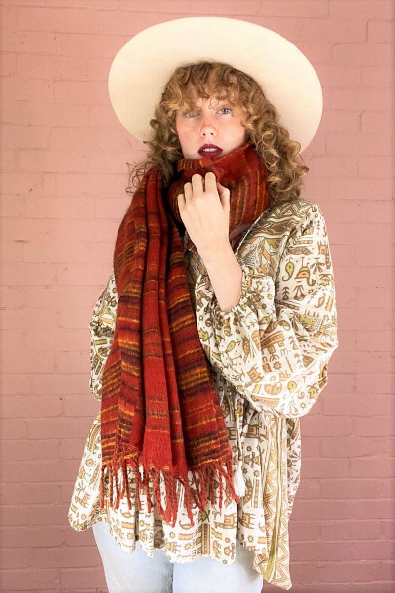 burnt red recycled indian scarf with black & mustard stripes, worn wrapped once around a model's neck - All About Audrey