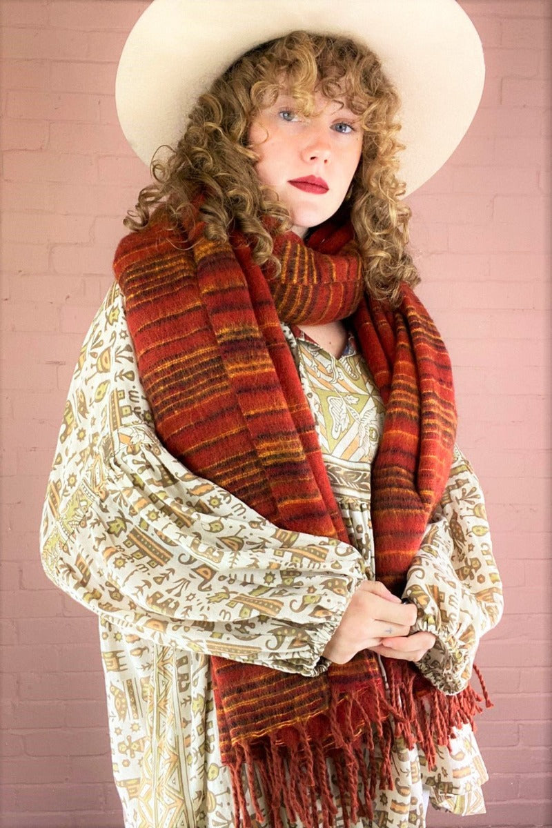 recycled Indian shawl in burnt red stripes worn wrapped around model's neck - All About Audrey