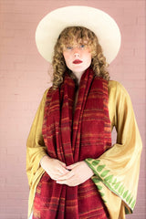 black and yellow stripy recycled Indian scarf with cherry red base draped around a model's neck - All About Audrey