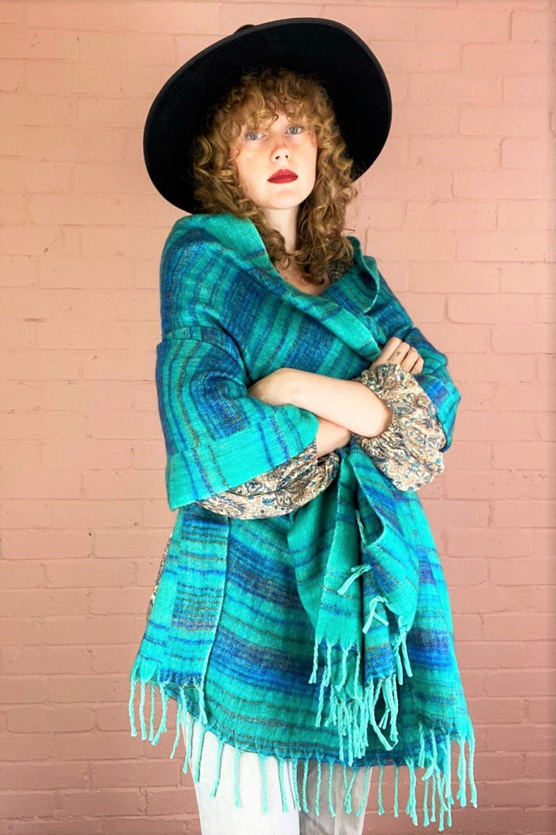 seafoam and blue recycled indian shawl worn draped over model's shoulders and upper body - All About Audrey