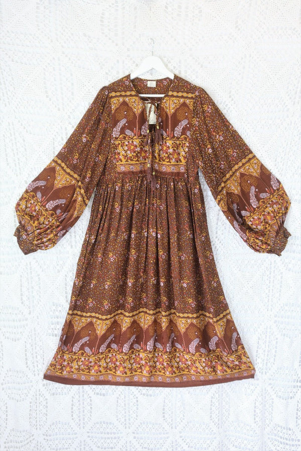 laid flat peacock primrose midi dress with balloon sleeves in 70s smocked style indian printed rayon colour gingerbread by all about audrey