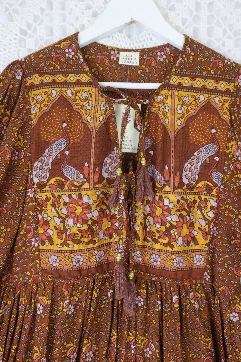 close up contrast yolk peacock primrose midi dress with balloon sleeves in 70s smocked style indian printed rayon colour gingerbread by all about audrey