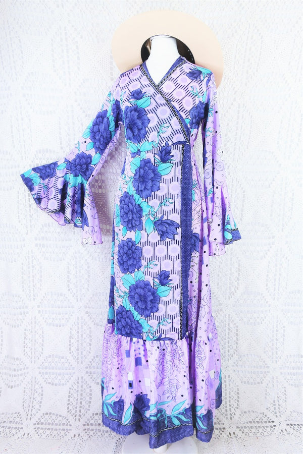 dusky purple and aqua floral print sylvia maxi boho wrap dress, pictured on a size 8 mannequin with the right arm pinned out to display the flared cuff