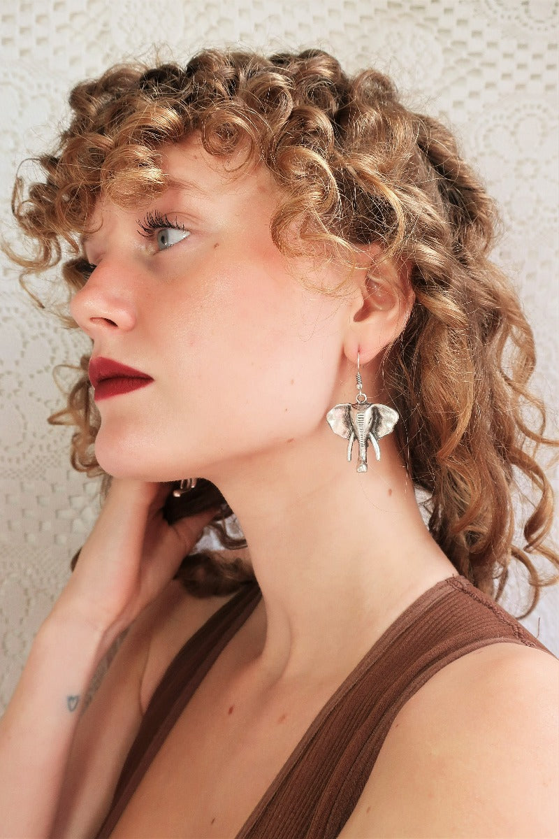 side view model wears bohemian elephant drop earrings from our collection of Turkish made jewellery by all about audrey