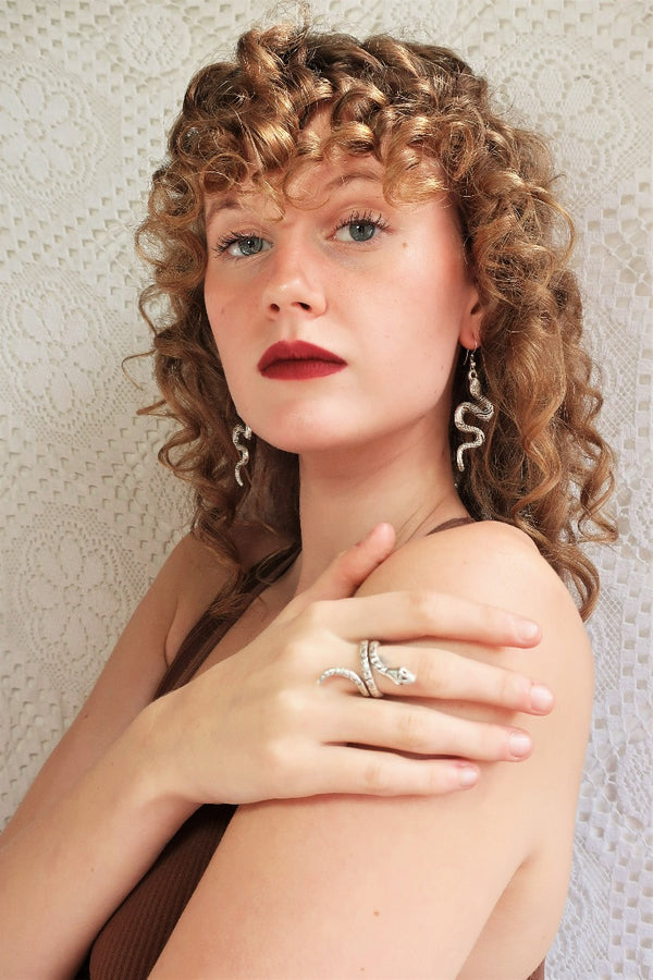 model wears silver plated coiled snake ring from our collection of bohemian turkish jewellery by all about audrey